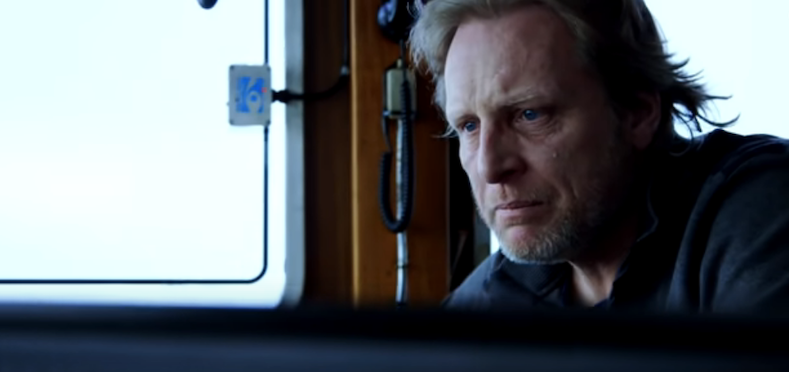 Sig Hansen looks upset and stares foward in his boat