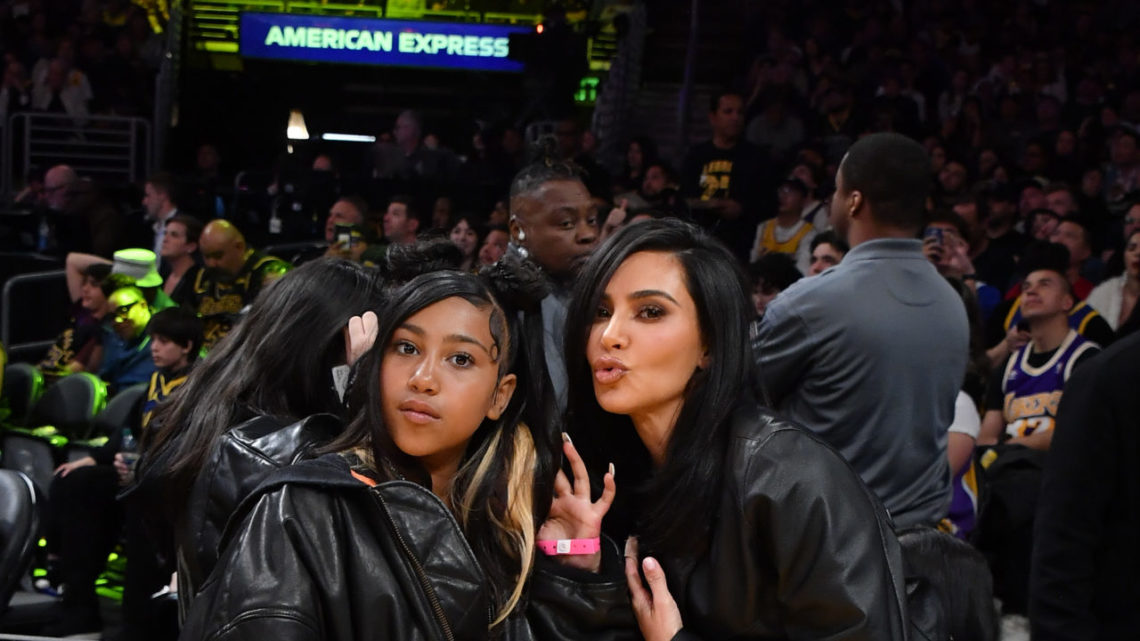 Kim Kardashian (R) and North West attend a basketball game between the Los Angeles Lakers and the Golden State Warriors at Crypto.com Arena on Apri...