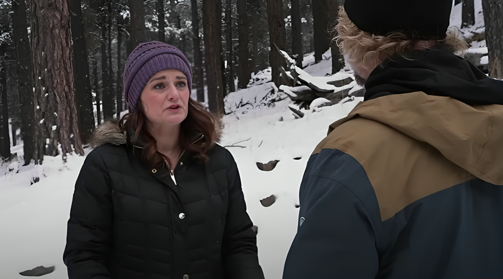 Robyn Brown appears close to tears as she wears hat and looks at Kody Brown on Sister Wives, in snow-covered forest.