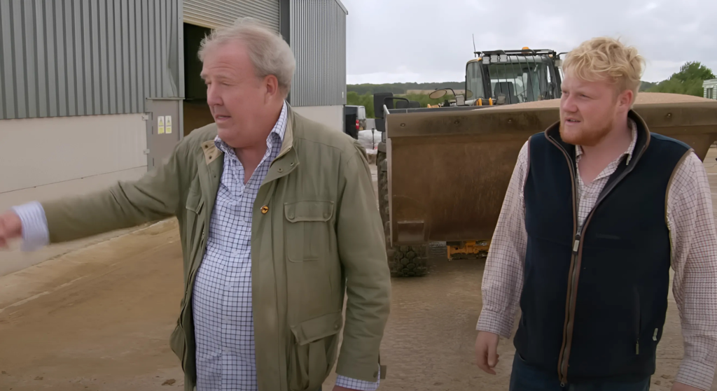 Jeremy Clarkson and Kaleb Cooper walk together on farm