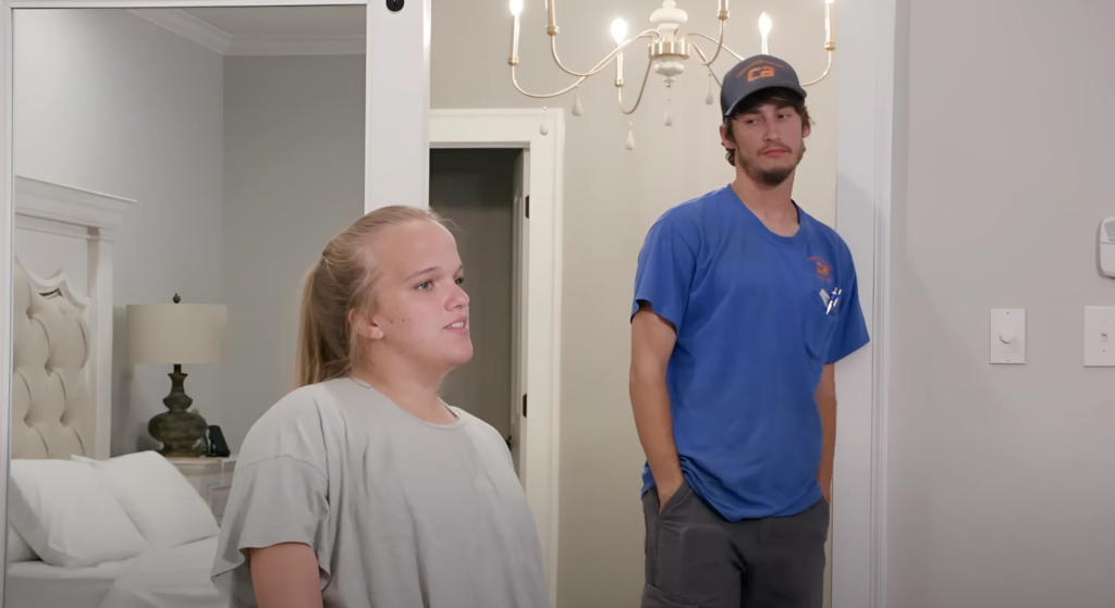 7 Little Johnstons Brice and Liz stand in house