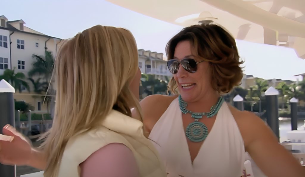 Luann smiles looking at Sonja Morgan on RHONY