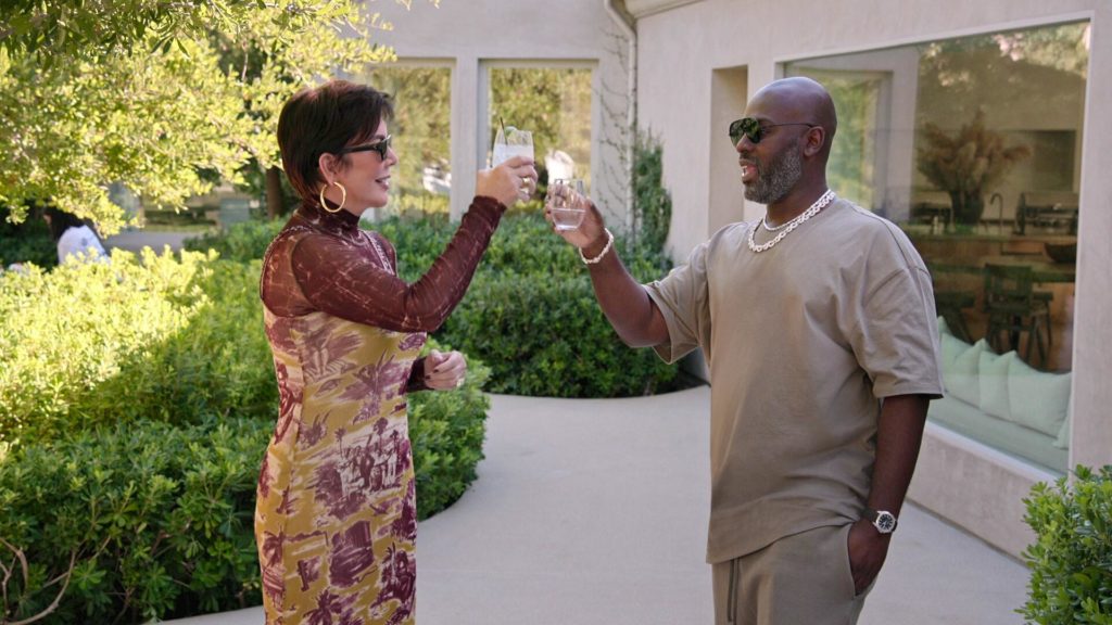 Kris Jenner and Corey Gamble toast outdoors on The Kardashians