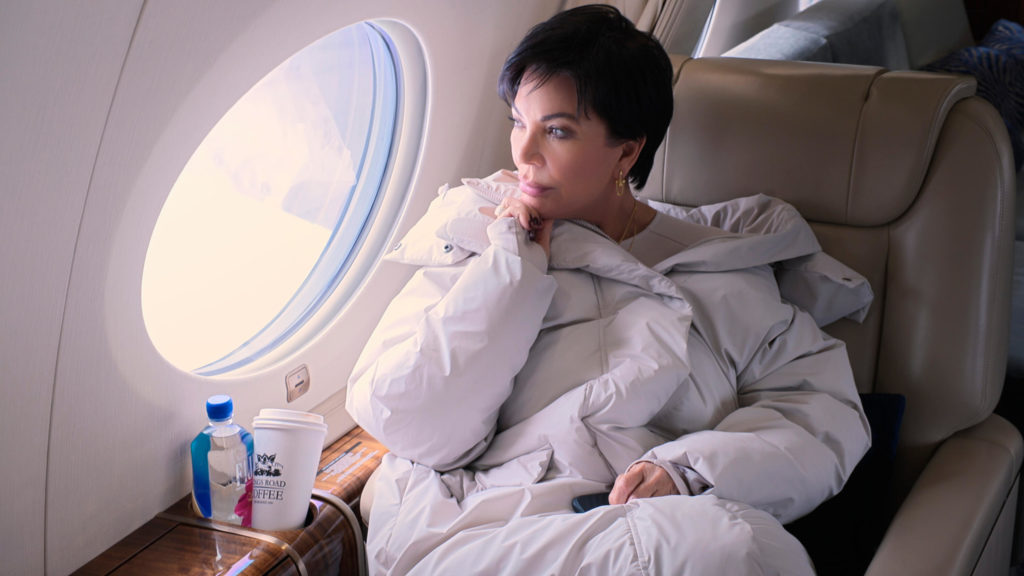 Kris Jenner looks out window on private jet