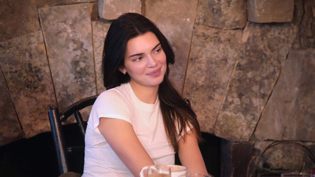 Kendall Jenner tilts head to left slightly with small smile on The Kardashians.