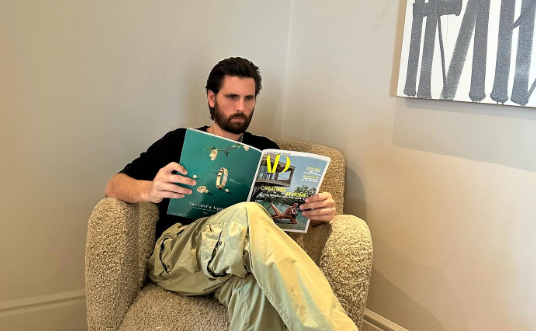 Scott Disick reads AD magazine.